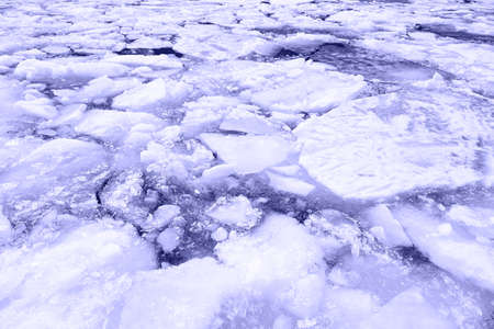 Texture of ice in trendy violet color. Winter natural background. Very Peri color of the year 2022.