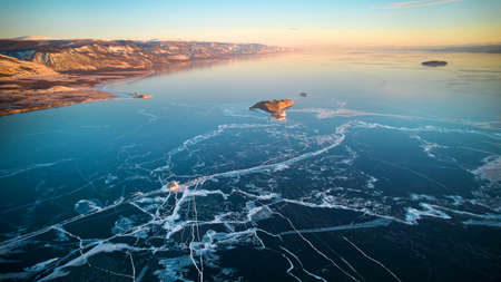 Aerial photography of Lake Baikal in winter. Frozen lake, transparent ice with cracks.の写真素材