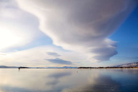 Lenticular cloud over the frozen Lake Baikal.の写真素材