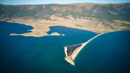 Lake Baikal from the air. View of the bay near the village of Kurma, Cape Uyuga.