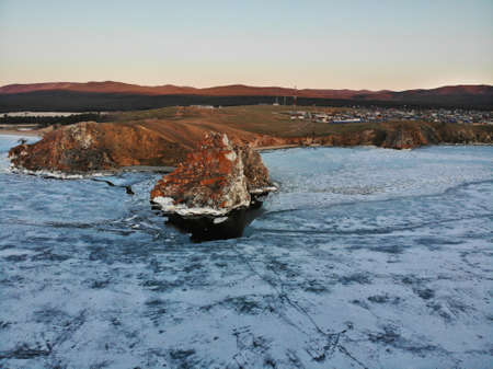 Aerial view of the village of Khuzhir, Olkhon Island, Cape Burkhan or Shamanka Rock. Lake Baikal in spring during the melting of ice.の写真素材