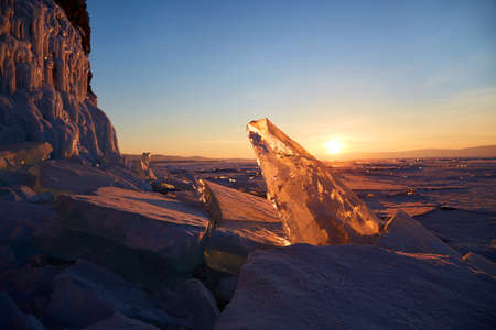 A beautiful sunset over the frozen Lake Baikal.
