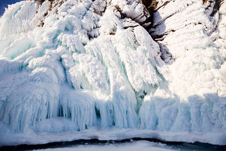 The rocks of the island of Olkhon in icicles of ice.
