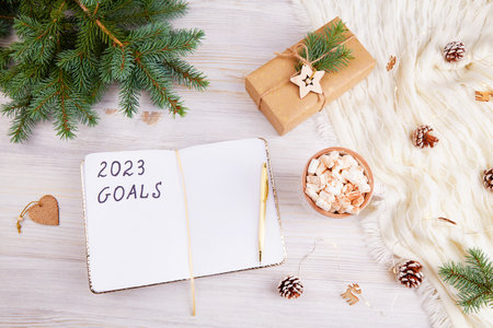 An open notebook with 2023 goals letters text.の写真素材