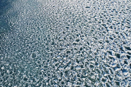 Ice floats in the water. abstract nature background.
