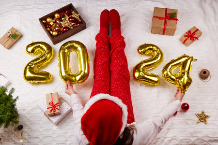 Happy New Year 2024. Golden balloons with numbers.