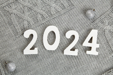 Wooden numbers 2024 and silver Christmas ballsの写真素材