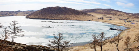 Lake Baikal in spring. Ice floes in the lake, the time of ice melting. Banner. Kurkutsky Bay.
