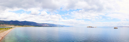 Beautiful seascape. Lake Baikal in summer. View of the bay and islands near the village of Kurma. Panoramaの写真素材