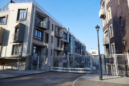 A modern residential complex with a closed area, a special architectural design with many balconies...