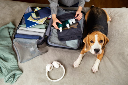 The girl is packing a suitcase for the trip, packing her luggage.の写真素材