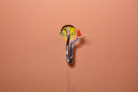 An electrical conduit box is built into the wall with wires sticking out as part of a home...