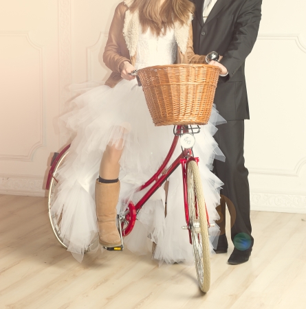groom and bride in wedding  beside old bicycleの写真素材