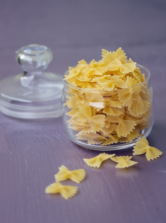 Pasta in the form of bow in a glass jarの写真素材