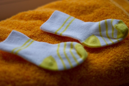 baby booties on towelの写真素材