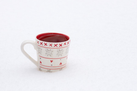 white cup on a background of a winter landscape, outdoorsの写真素材