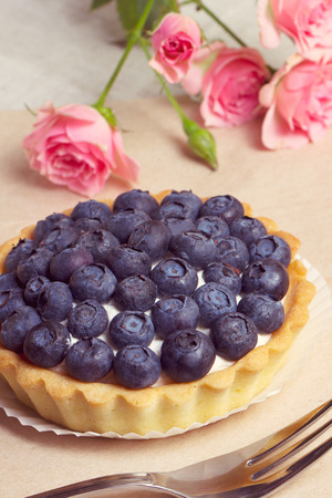Blueberry pie and berries on rustic wooden tableの写真素材