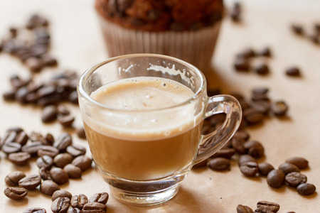 Cup of latte coffee with a biscotti