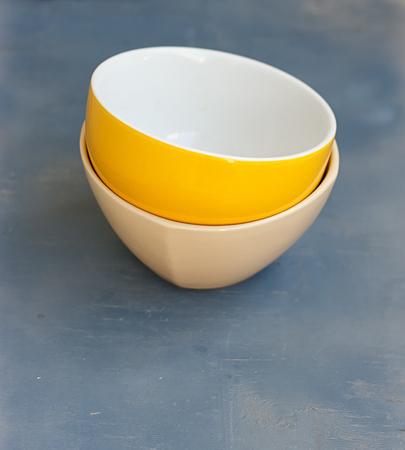 Stack of Colorful Bowls on Wooden Backgroundの写真素材