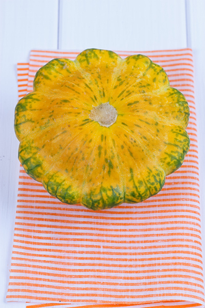 Autumn squash and zucchini on a table cloth.の写真素材