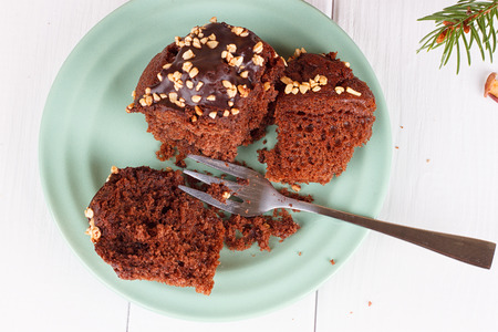 chocolate Muffin on a Wooden white Table.
