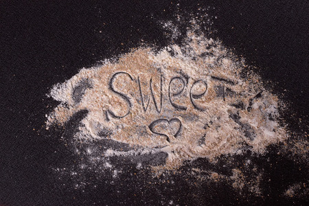 White whole-wheat flour and a spoonの写真素材