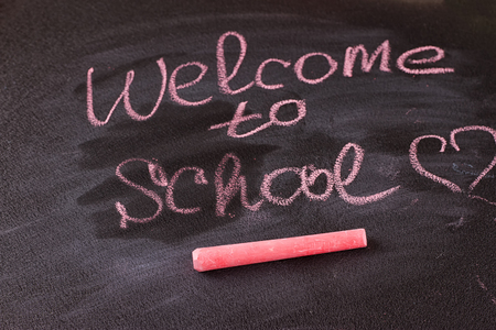 Back to school blackboardchalkboard. writing back to school on black chalk board.の写真素材