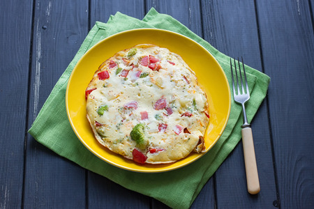 Hearty and tasty breakfast, traditional in the hotel, omelette from chicken eggs with cheese, fresh...