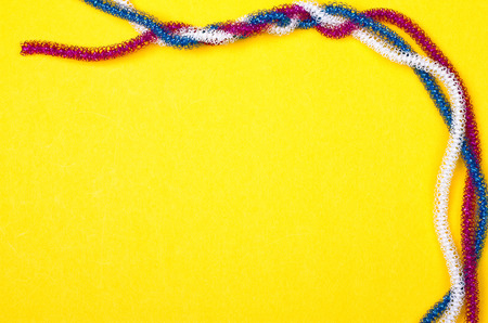 blue pink white rope on a yellow backgroundの写真素材