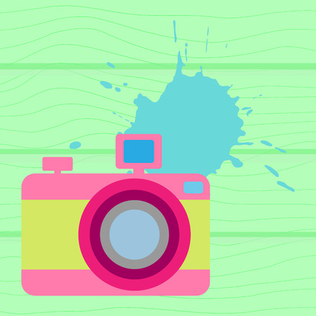 Vector illustration. The old-fashioned color camera. Flat style. Splash on a wooden backgroundのイラスト素材