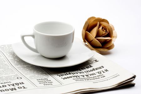 coffee cup with rose and newspaperの写真素材