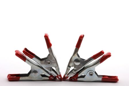 four red color clamps background