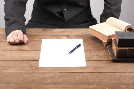 part of hands signing a contractの写真素材