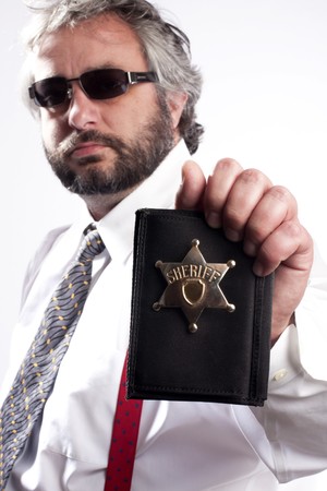 Police officer show identification badgeの写真素材