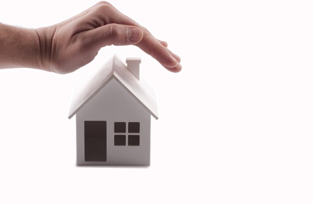 house under hand cover backgroundの写真素材