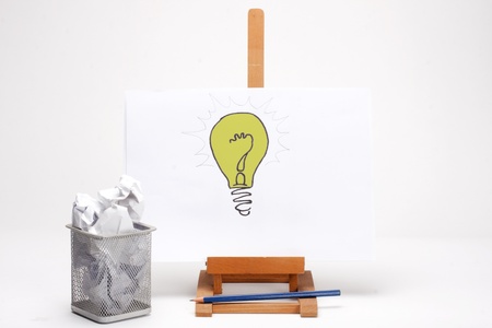 light bulb with many pieces paperの写真素材