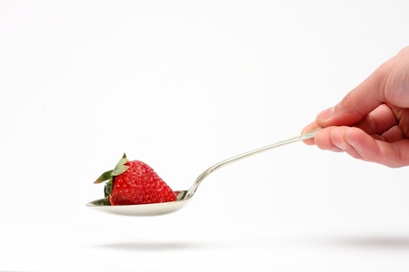 spoonful of strawberry close upの写真素材
