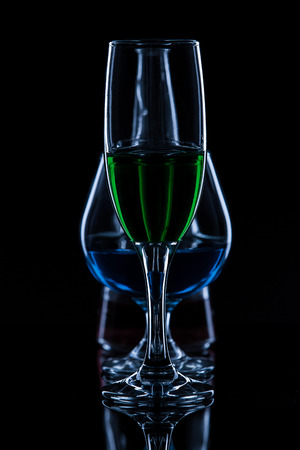 Color wine glass on black backgroundの写真素材