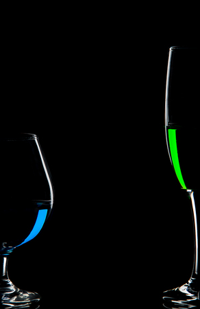 Color wine glass on black backgroundの写真素材