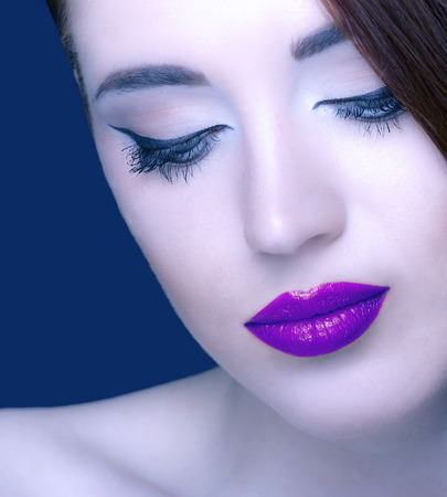 Gorgeous young woman with long eyelashes. Perfect makeup.の写真素材