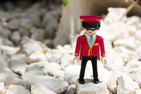 Miniature plastic toy. Man in the form of a passengerの写真素材