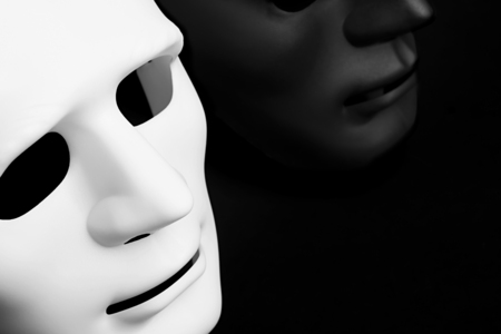 Black and white carnival mask on black backgroundの写真素材