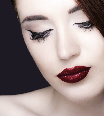 Gorgeous young woman with long eyelashes. Perfect makeup.の写真素材