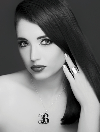 charming girl with a ring and necklace.の写真素材