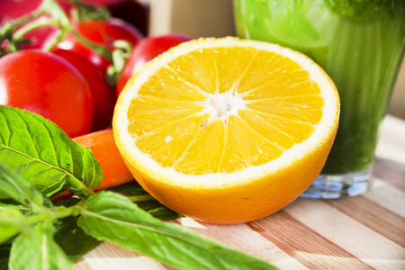Orange half for smoothie on a wooden boardの写真素材