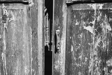 Door handle on an antique wooden doorの写真素材