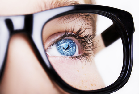 Portrait of a boy wearing eyeglasses blue eyes close, macro studio shotの写真素材