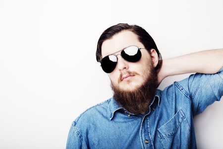 Studio portrait of caucasian young man on white backgroundの写真素材