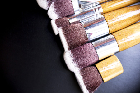 Professional makeup brushes collection on black backgroundの写真素材