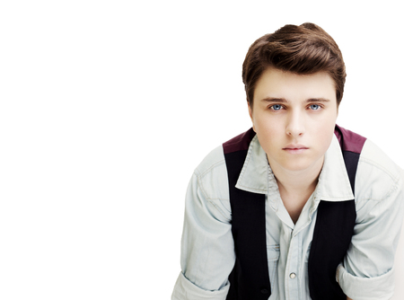 Stylish handsome young man posing. Studio shot on white background